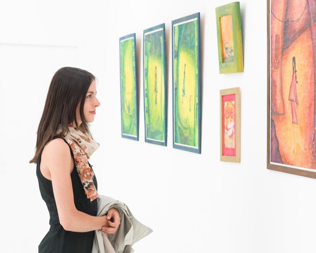 Woman looking at art